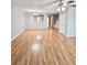 Open living space with hardwood floors, a ceiling fan, and access to other rooms, creating a welcoming atmosphere at 3948 Oak Glenn Dr, Duluth, GA 30096