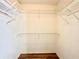 Walk-in closet with white metal racks and wood floor at 3948 Oak Glenn Dr, Duluth, GA 30096