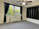 Bright bedroom with large window, ceiling fan and built in shelving unit at 2479 Peachtree Ne Rd # 317, Atlanta, GA 30305