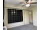 The room has a ceiling fan and a built-in shelving unit next to a doorway at 2479 Peachtree Ne Rd # 317, Atlanta, GA 30305