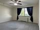 A tranquil bedroom featuring neutral walls, ceiling fan and plush gray carpeting creating a cozy retreat at 2479 Peachtree Ne Rd # 317, Atlanta, GA 30305