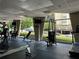 Well-equipped fitness center with large windows and various exercise machines and equipment at 2479 Peachtree Ne Rd # 317, Atlanta, GA 30305
