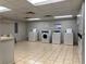 Well-equipped laundry room with multiple washers and dryers for resident convenience at 2479 Peachtree Ne Rd # 317, Atlanta, GA 30305