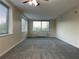 Living room filled with natural light, featuring a ceiling fan and multiple large windows at 2479 Peachtree Ne Rd # 317, Atlanta, GA 30305