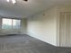 A living room featuring a large window, ample natural light and a closet at 2479 Peachtree Ne Rd # 317, Atlanta, GA 30305