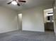 The bedroom has neutral walls, gray carpeting, and easy access to an en-suite bathroom at 2479 Peachtree Ne Rd # 317, Atlanta, GA 30305