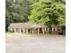 Traditional brick home featuring a covered front porch with classic white columns at 3006 East Point Street, East Point, GA 30344
