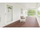 Relaxing covered porch with painted wood flooring and bead board ceiling at 4615 Gresham Rd, Douglasville, GA 30134