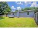 Well manicured backyard features a charming deck, lawn and wooded surroundings at 502 Snowfall Ter, Palmetto, GA 30268