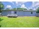 This grassy backyard includes a wooden deck, perfect for outdoor relaxation and activities at 502 Snowfall Ter, Palmetto, GA 30268