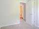 Bedroom featuring carpeted floors with a view into an attached bathroom at 502 Snowfall Ter, Palmetto, GA 30268
