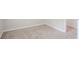 Carpeted bedroom featuring fresh paint, base trim, and a doorway at 502 Snowfall Ter, Palmetto, GA 30268
