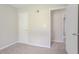 Bedroom showcasing plush carpeting, fresh paint, and multiple doorways at 502 Snowfall Ter, Palmetto, GA 30268