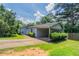 Charming single-story home with a covered carport, lush landscaping and well-manicured lawn at 502 Snowfall Ter, Palmetto, GA 30268
