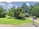 Inviting home with a well-maintained lawn, mature trees, and a traditional mailbox for added curb appeal at 502 Snowfall Ter, Palmetto, GA 30268
