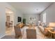 Stylishly furnished living room with contemporary decor, plush seating, and ample natural light at 502 Snowfall Ter, Palmetto, GA 30268