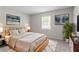 Serene bedroom featuring stylish décor, a cozy bed, and ample natural light for relaxation at 502 Snowfall Ter, Palmetto, GA 30268