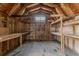 Rustic unfinished shed interior, features exposed beams, wooden walls, shelving and workbenches at 502 Snowfall Ter, Palmetto, GA 30268