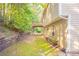 View of backyard and wooden retaining wall with an under-deck area at 5033 Kens Ct, Stockbridge, GA 30281