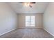 Spacious bedroom featuring neutral paint, carpet, and natural light from a window at 5033 Kens Ct, Stockbridge, GA 30281