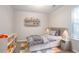 Comfortable bedroom with neutral tones, storage bed, and lots of natural light at 5033 Kens Ct, Stockbridge, GA 30281