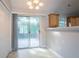 Bright dining area with sliding glass doors, neutral paint, and access to an adjacent kitchen at 5033 Kens Ct, Stockbridge, GA 30281