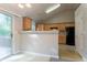Bright kitchen with wooden cabinets, black appliances, lots of natural light, and vaulted ceilings at 5033 Kens Ct, Stockbridge, GA 30281