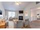 Bright living room features a fireplace, lots of natural light, and comfortable seating at 5033 Kens Ct, Stockbridge, GA 30281