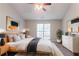 Cozy bedroom with minimalist decor, natural wood accents, and large windows at 5033 Kens Ct, Stockbridge, GA 30281