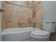 Bathroom featuring tile shower, toilet and tub at 5383 Forest East Ln, Stone Mountain, GA 30088