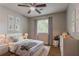Comfortable bedroom with a ceiling fan, a neutral color palette, soft carpet and ample natural light at 5383 Forest East Ln, Stone Mountain, GA 30088