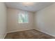 Bright bedroom with large window, neutral walls, and soft carpet at 5383 Forest East Ln, Stone Mountain, GA 30088