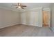 Large bedroom with carpet, dual closets, and doorway to bathroom at 5383 Forest East Ln, Stone Mountain, GA 30088
