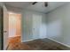 Cozy bedroom features soft carpet, neutral paint, and a door leading to another room at 5383 Forest East Ln, Stone Mountain, GA 30088