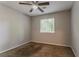 Cozy bedroom with neutral walls, carpeted floors, and a window for natural light at 5383 Forest East Ln, Stone Mountain, GA 30088