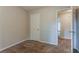 Neutral bedroom featuring soft carpet and doorway to an adjacent room at 5383 Forest East Ln, Stone Mountain, GA 30088