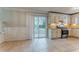Open kitchen and dining area with tiled floors, stainless steel appliances, sliding door access to the backyard at 5383 Forest East Ln, Stone Mountain, GA 30088