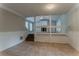 An open-concept living room with tile flooring leads to the upper level with stairs at 5383 Forest East Ln, Stone Mountain, GA 30088