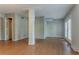 A living room space with hardwood floors and large support column at 5383 Forest East Ln, Stone Mountain, GA 30088