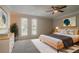 Tranquil main bedroom featuring a minimalist bed frame, soft carpet, bright windows, and calming decor at 5383 Forest East Ln, Stone Mountain, GA 30088