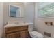Bathroom with light-colored walls, vanity and sink at 573 Allgood Rd, Stone Mountain, GA 30083
