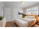 Bright bedroom with a bed and lots of natural light from two windows at 573 Allgood Rd, Stone Mountain, GA 30083