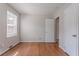 Bright bedroom features beautiful hardwood floors and a closet space at 573 Allgood Rd, Stone Mountain, GA 30083