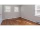 This bedroom has lovely hardwood floors and two windows at 573 Allgood Rd, Stone Mountain, GA 30083