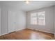 Bright bedroom with hardwood floors, natural light, and ample closet space at 573 Allgood Rd, Stone Mountain, GA 30083