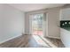 Bright dining area with sliding glass doors to a deck and wood-look flooring at 573 Allgood Rd, Stone Mountain, GA 30083