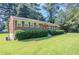 Well-maintained brick house with green shutters and a lush lawn at 573 Allgood Rd, Stone Mountain, GA 30083
