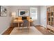 Cozy home office space with wooden desk, rug, and ample shelving at 573 Allgood Rd, Stone Mountain, GA 30083