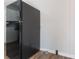 Kitchen with a black Amana refrigerator and wood-look flooring at 573 Allgood Rd, Stone Mountain, GA 30083