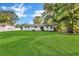 Large backyard with a well-maintained lawn and mature trees at 288 Valerie Cir, Hiram, GA 30141